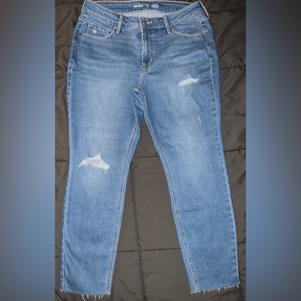 Distressed light blue jeans